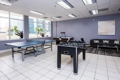 a room with two ping pong tables and a couch at SPECTACULAR apt Brickell Miami FREE PARKING in Miami