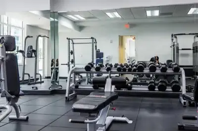 a gym with a lot of weights and machines at Exclusive 2BR APT Brickell Free Parking in Miami
