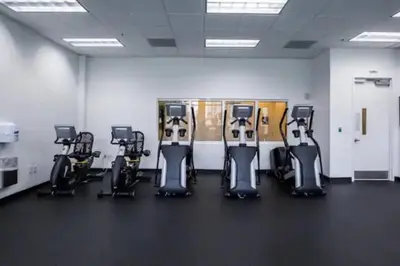 a fitness room with a row of exercise bikes at Lovely 2BR in the Heart of Brickell Free Parking in Miami