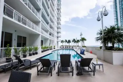 a swimming pool in the middle of a building at Lovely 2BR in the Heart of Brickell Free Parking in Miami