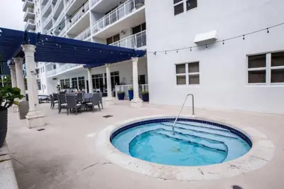 a swimming pool in front of a building at Lovely 2BR in the Heart of Brickell Free Parking in Miami
