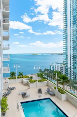 a swimming pool on a balcony with a view of the ocean at 2bedroom ocean views brickell free parking in Miami