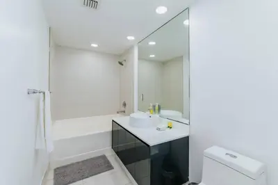 a bathroom with a sink and a tub and a toilet at Exclusive, Amazing, Bright and Spacious at Brickell in Miami