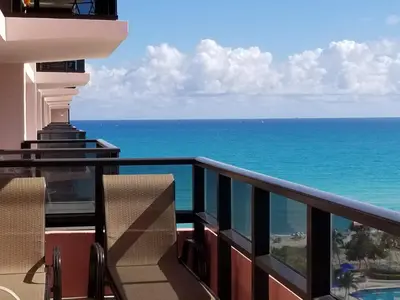 a balcony with a view of the ocean at Alexander14192 in Miami Beach