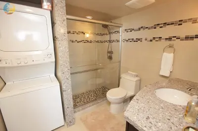 a bathroom with a shower and a toilet and a sink at Alexander14192 in Miami Beach