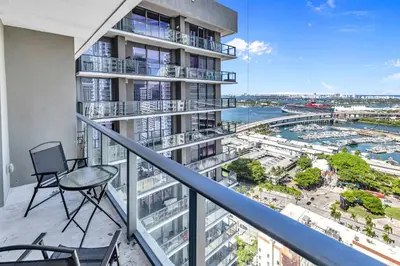 an apartment balcony with a view of a harbor at Sunset Waterview Oasis Studio in Miami