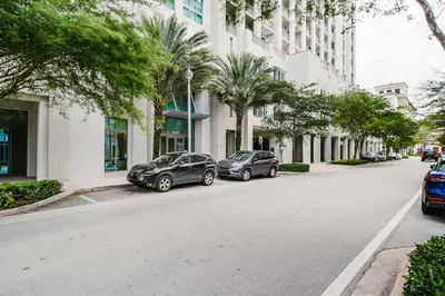 two cars parked on the side of a street with buildings at Blueground Brickell pool wd near city center MIA-127 in Miami
