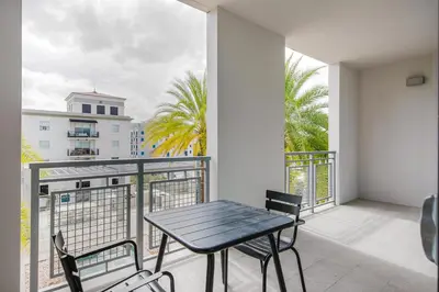 a patio with a table and chairs on a balcony at Blueground Brickell pool wd near city center MIA-127 in Miami