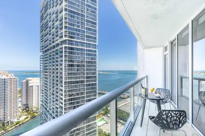 a balcony with a view of a tall building at MVR - Floor 45 Views & Spa Bliss in Miami