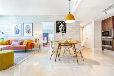 a living room with a table and a couch at MVR - Floor 45 Views & Spa Bliss in Miami