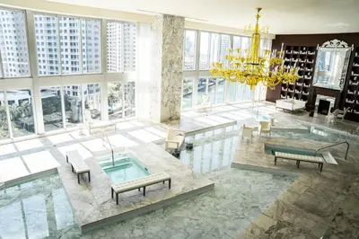 a large room with a chandelier and a pool at MVR - Magnificent Bay & River Views SPA Balcony in Miami