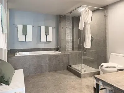 a bathroom with a shower and a tub and a toilet at MVR - Magnificent Bay & River Views SPA Balcony in Miami