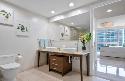 a bathroom with two sinks and a toilet at MVR - Designer Condo in Prime Brickell in Miami