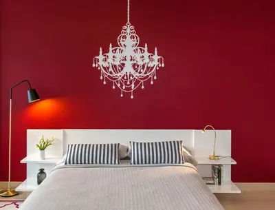 a bedroom with a red wall with a chandelier at MVR - River & City Views Brickell Center LuxSPA in Miami