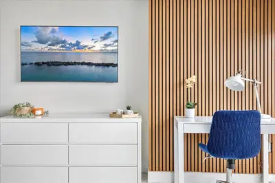 a room with a desk and a blue chair at MVR Sleek Condo with Iconic Views in Miami