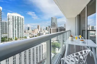 a balcony with a table and a view of a city at MVR - Luxury & Location at Icon Brickell in Miami