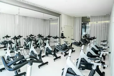 a gym with a row of treadmills at MVR - Best Views in Brickell in Miami