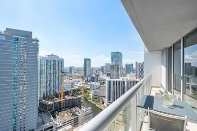 an apartment balcony with a view of a city at MVR - Wake Up to Brickell-s Best Views in Miami
