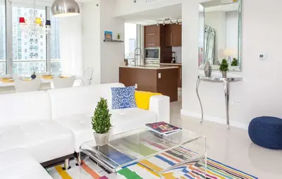a living room with a white couch and a table at MVR - High-Floor Luxury with Iconic Views in Miami