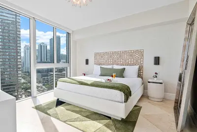 a bedroom with a large bed and a large window at MVR - Luxury Tower Stay with Miami Views in Miami