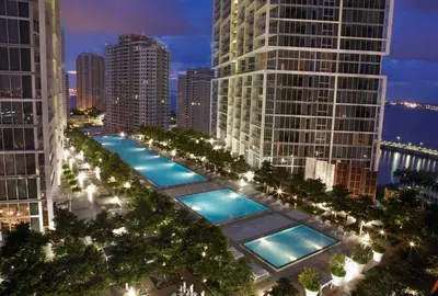 a row of pools in a city at night at MVR - Oceanfront Corner Balcony Luxe SPA in Miami