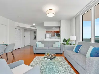 a living room with two couches and a table at MVR - Coconut Grove-s Oasis of Comfort and Elegance in Miami