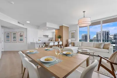 a dining room and living room with a table and chairs at MVR-No More Hassles-Just Peace & Luxury in Miami
