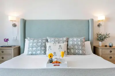 a bedroom with a large white bed with a tray on it at MVR-No More Hassles-Just Peace & Luxury in Miami
