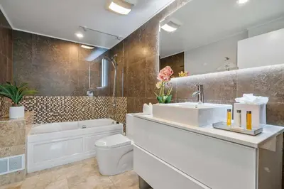 a bathroom with a sink and a tub and a toilet at MVR-Coconut Grove-s Best Kept Secret-Revealed in Miami