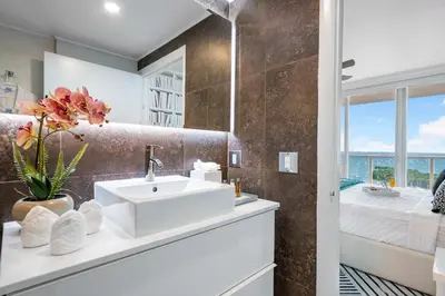 a bathroom with a sink and a view of a bedroom at MVR-Coconut Grove-s Best Kept Secret-Revealed in Miami