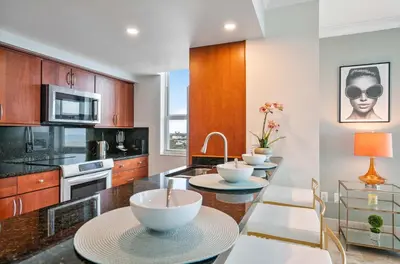 a kitchen with three tables with bowls on them at MVR-Coconut Grove-s Best Kept Secret-Revealed in Miami