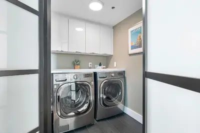 a laundry room with a washer and dryer at MVR-Bask in Luxury-Right in Coconut Grove in Miami