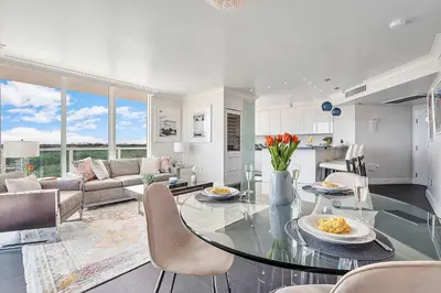 a kitchen and living room with a glass table at MVR - Elevate Your Stay with Panoramic Bay Views in Miami