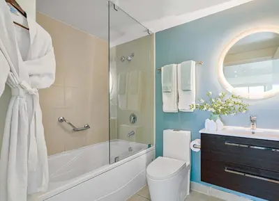 a bathroom with a tub and a toilet and a sink at MVR-Your Gateway to Miami-s Culture & Calm in Miami