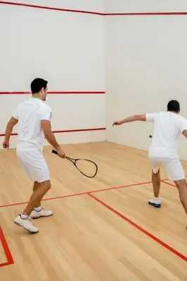 two men playing a game of tennis on a court at MVR - Gorgeous Views and Refined Living Spaces in Miami