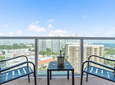 a balcony with a table and two chairs and a view at MVR - Where Style Comfort and Convenience Meet in Miami