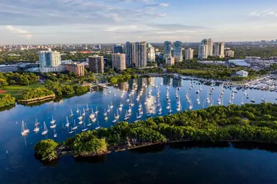 an aerial view of a city with boats in the water at MVR-Balcony Apartments Filling Up-Act Now in Miami