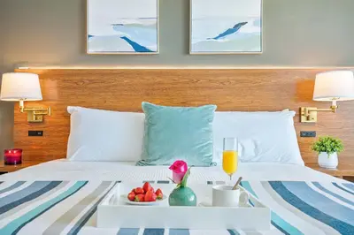 a hotel room with a tray of food on a bed at MVR - The Best of Work Relaxation in One in Miami