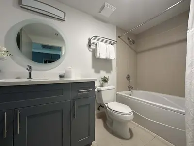 a bathroom with a sink and a toilet and a mirror at MVR-Modern Touches Coconut Grove Warmth in Miami