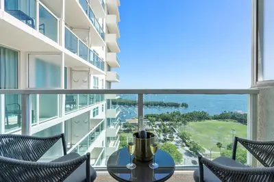 a view from the balcony of a building with a table and chairs at MVR - Sunsets So Good You-ll Book Twice in Miami