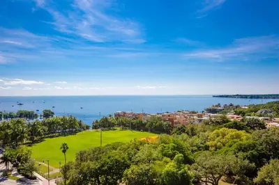 a view of a park with the ocean in the background at MVR-Stop Searching-This Stay Has It All in Miami