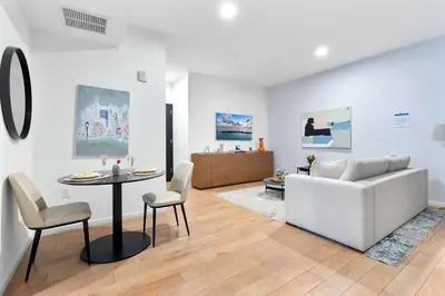 a living room with a white couch and a table at MVR - Walkable Downtown Gem with Breathtaking Views in Miami