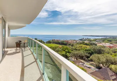 a balcony with a view of the ocean at MVR - Miami's Most Exclusive Stay-Revealed in Miami