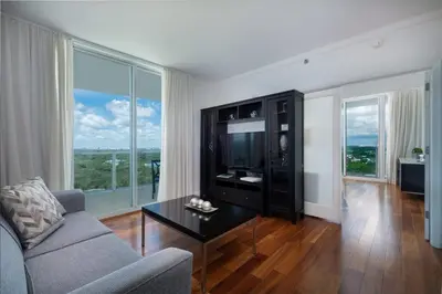 a living room with a couch and a tv at MVR - Biscayne Bay Views That Stun Daily in Miami