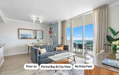 a living room with a couch and a view of the ocean at MVR - Rooftop Access Rooms-Almost Gone in Miami