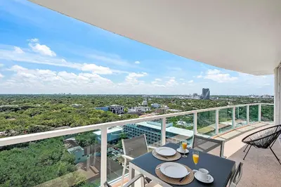 a balcony with a table and chairs and a view at MVR - Rooftop Access Rooms-Almost Gone in Miami