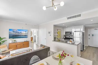 a living room and kitchen with a couch and tables at MVR - Rooftop Access Rooms-Almost Gone in Miami