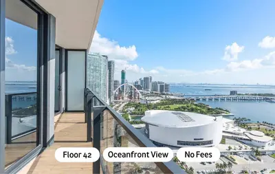 an apartment balcony with a view of a city at MVR - 5-Star Resort Pool & Private Balcony in Miami