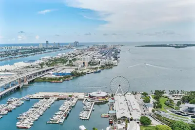 an aerial view of a marina with a ferris wheel at MVR - Designer Apt with Jaw-Dropping Views & Pool in Miami