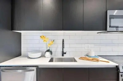 a kitchen with a sink and a counter top at MVR - Designer Apt with Jaw-Dropping Views & Pool in Miami